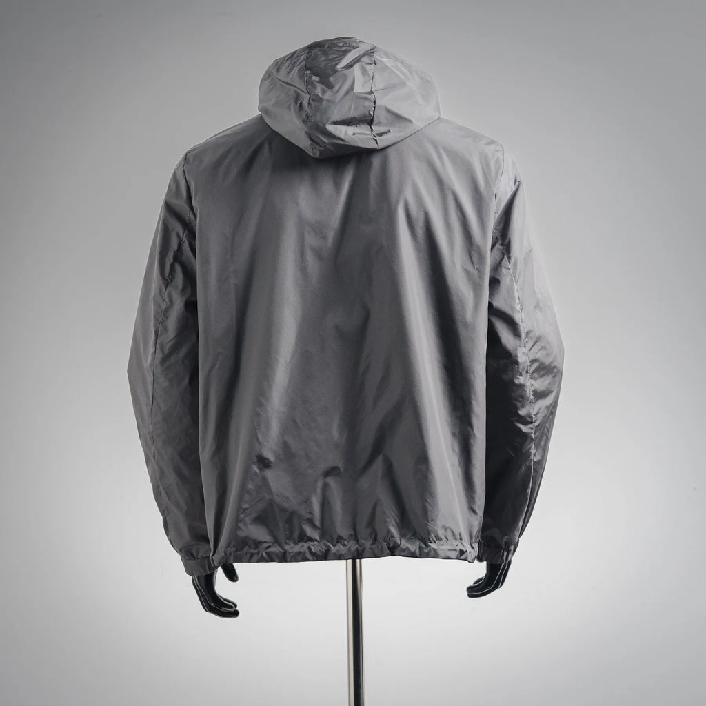 Dark gray hooded jacket with front zip and gathered cuffs, back view