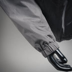 Sleeve cuff close-up on dark gray hooded jacket with black glove-like cuff