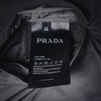 PRADA size XL care label on dark jacket lining, with model and washing instructions