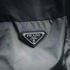 Prada triangle logo patch on black jacket chest