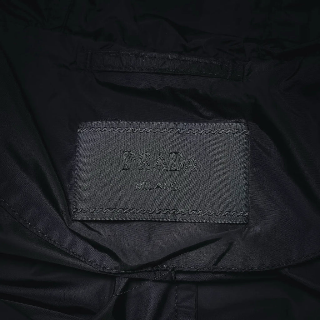 Prada brand size label inside black jacket collar