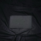Prada brand size label inside black jacket collar