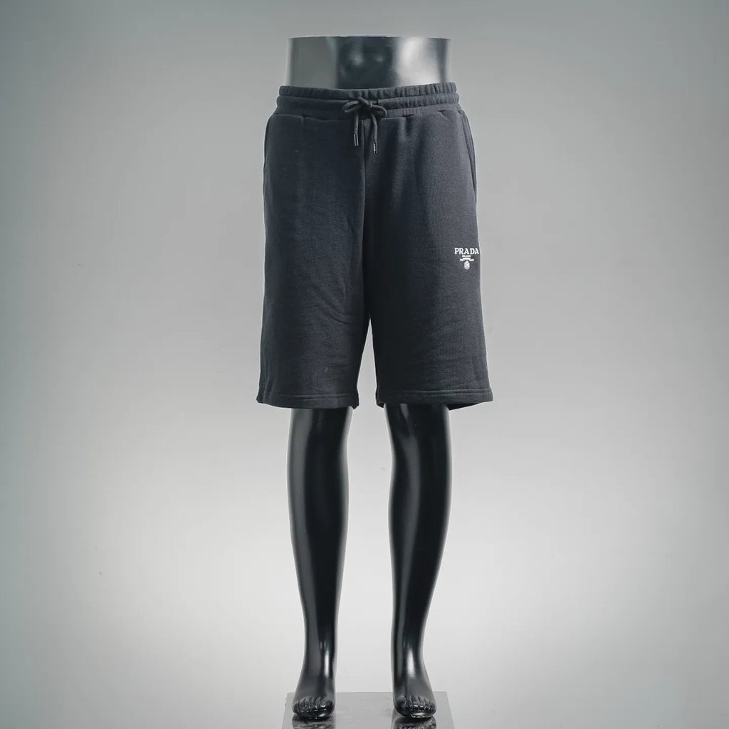 Navy drawstring shorts with elastic waistband and Prada logo patch