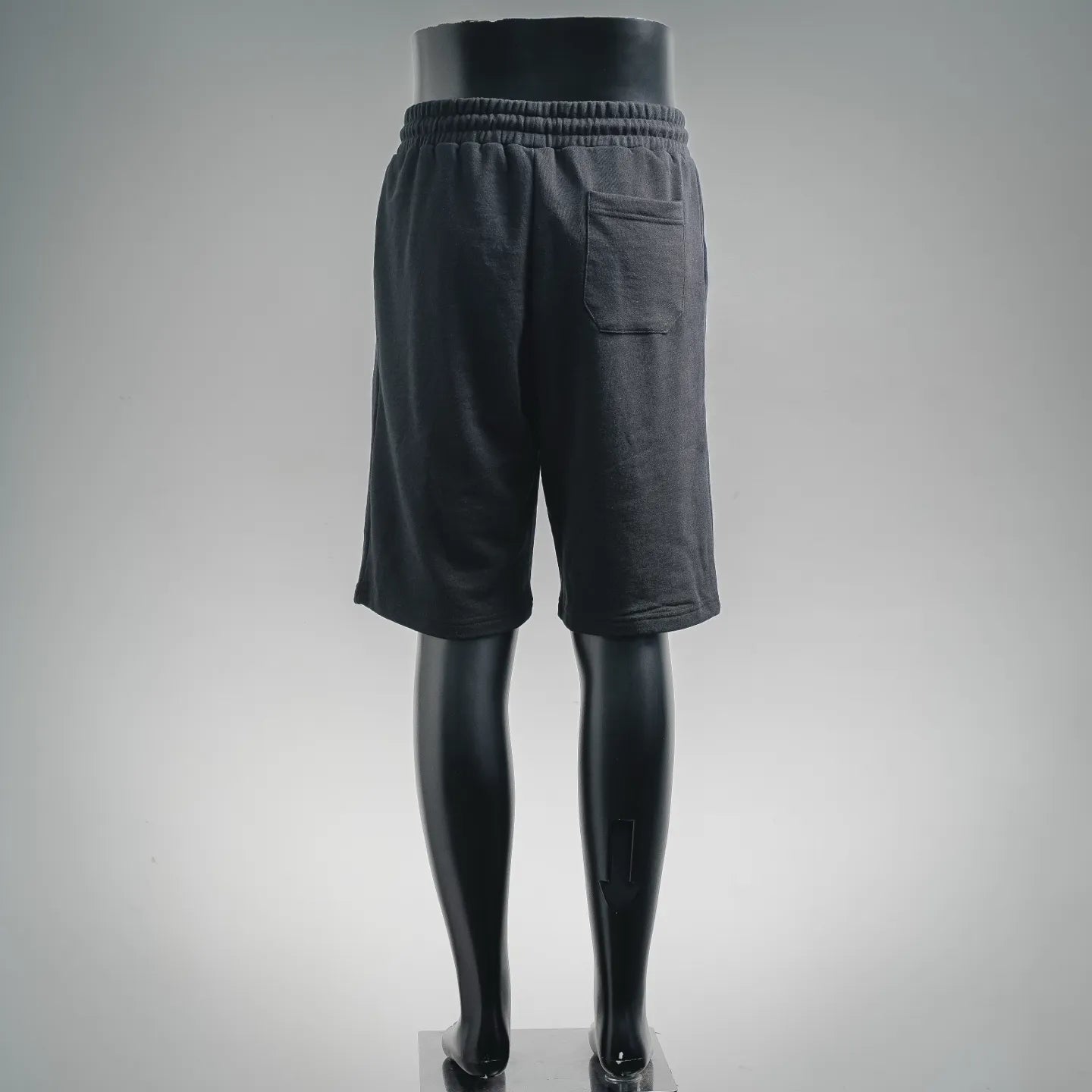 Navy drawstring shorts with elastic waistband, back view