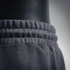 Elastic waistband texture on dark knit shorts