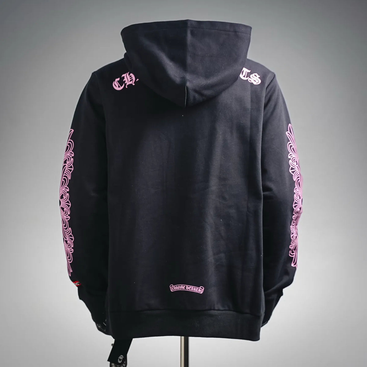 Chrome Hearts back-view hoodie with hood, sleeve graphic accents, and small bottom logo.