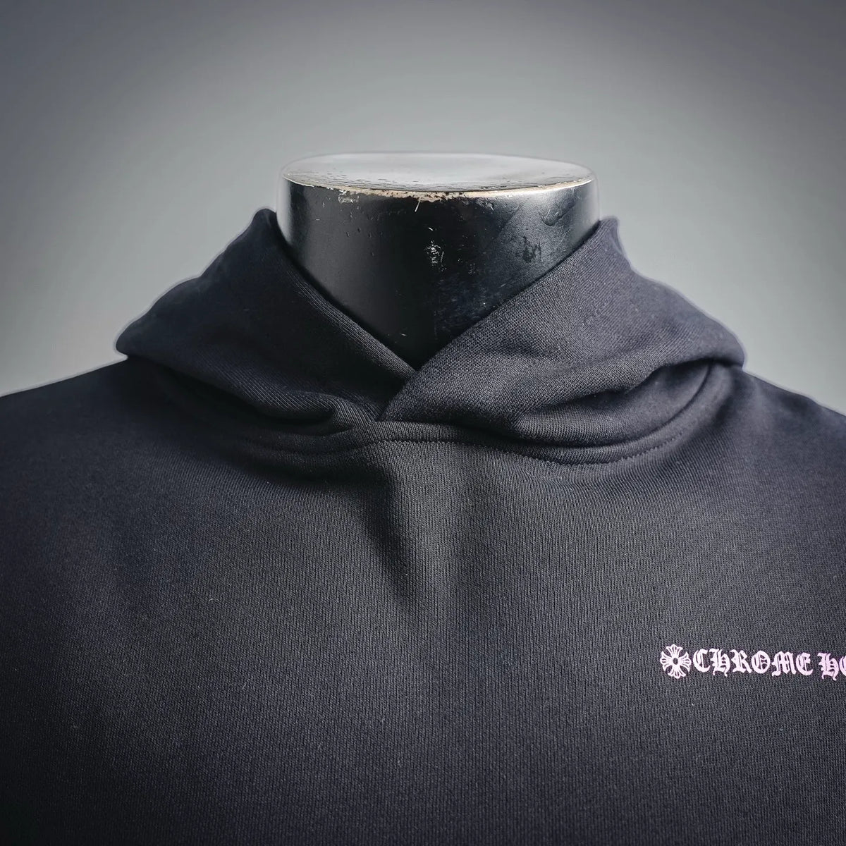Chrome Hearts hoodie neckline and hood with small pink chest logo.