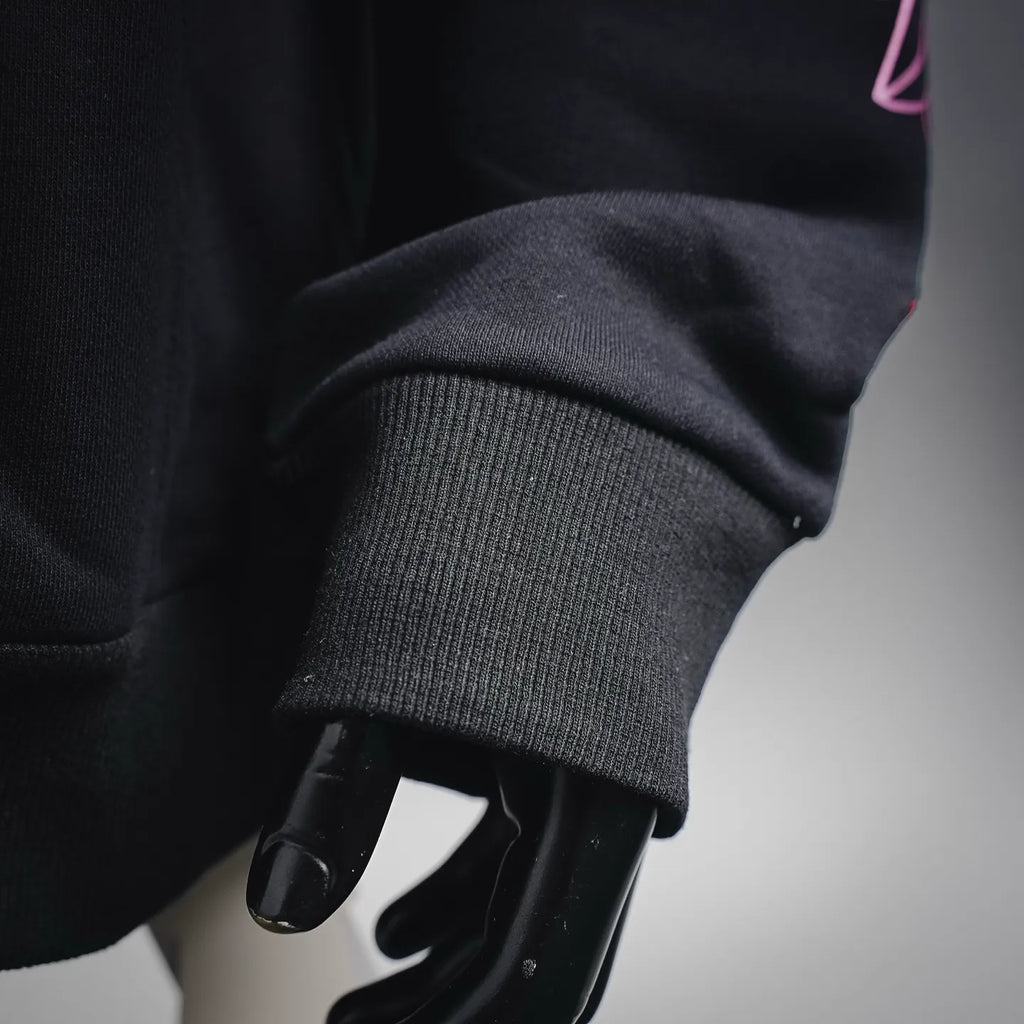Chrome Hearts hoodie sleeve cuff and ribbed hem detail.