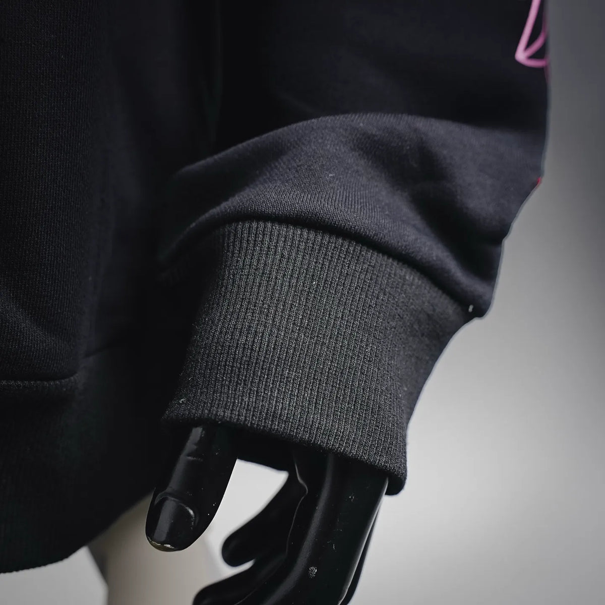 Chrome Hearts hoodie sleeve cuff and ribbed hem detail.