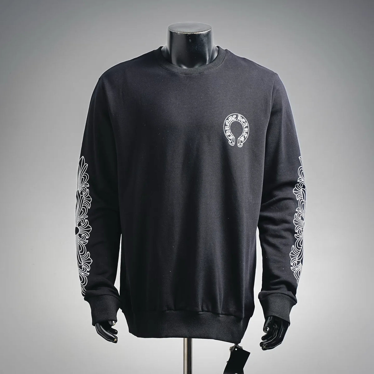 Black crewneck long-sleeve sweatshirt with small white logo on the chest
