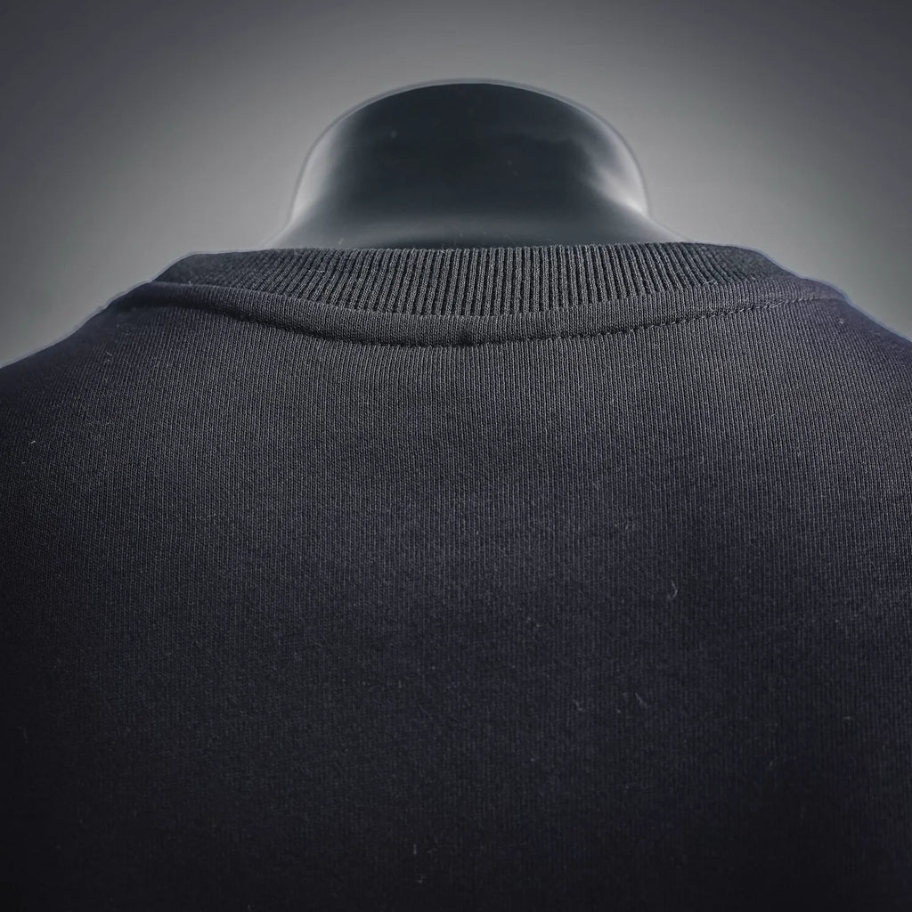 Black sweatshirt neckline with ribbed knit collar detail