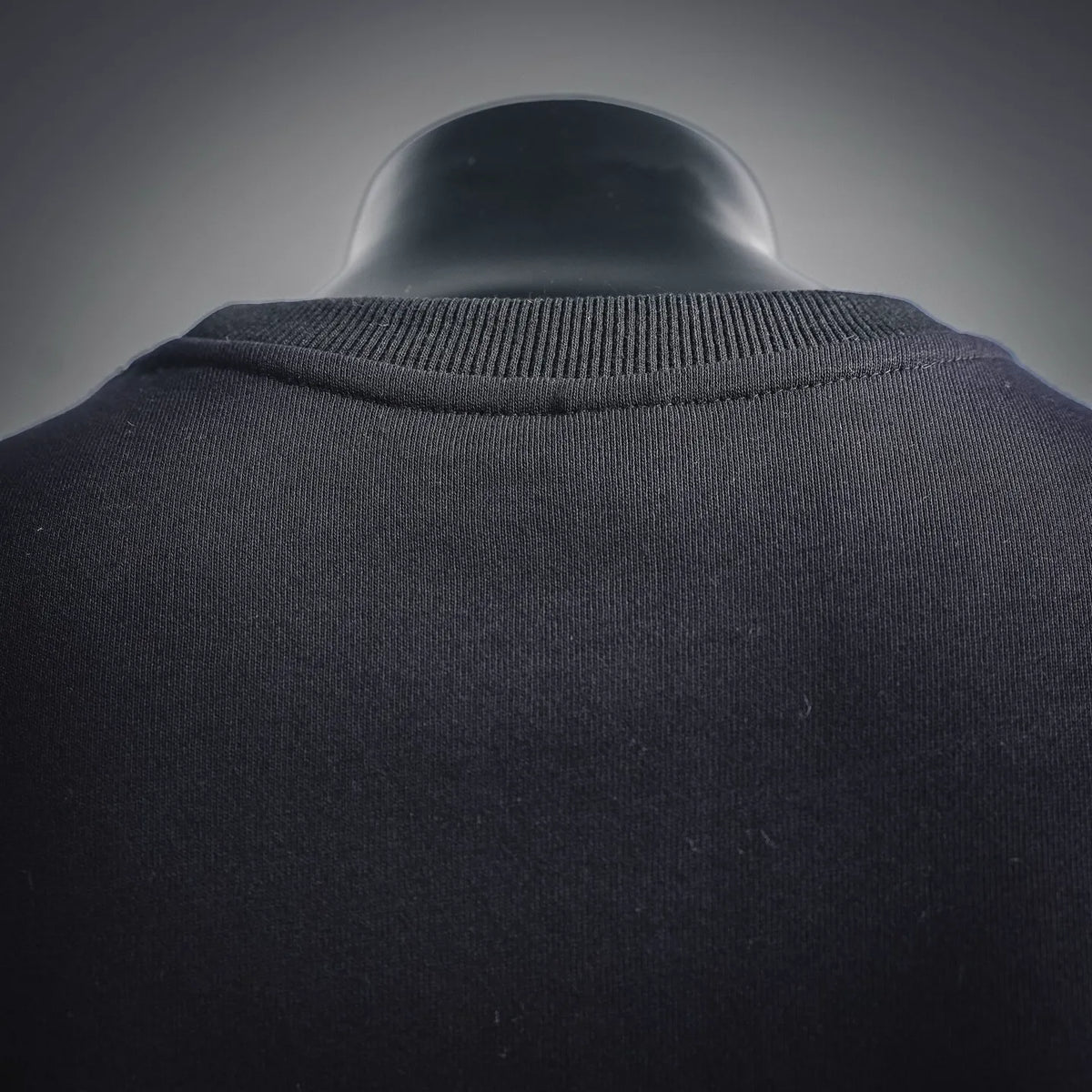 Black sweatshirt neckline with ribbed knit collar detail