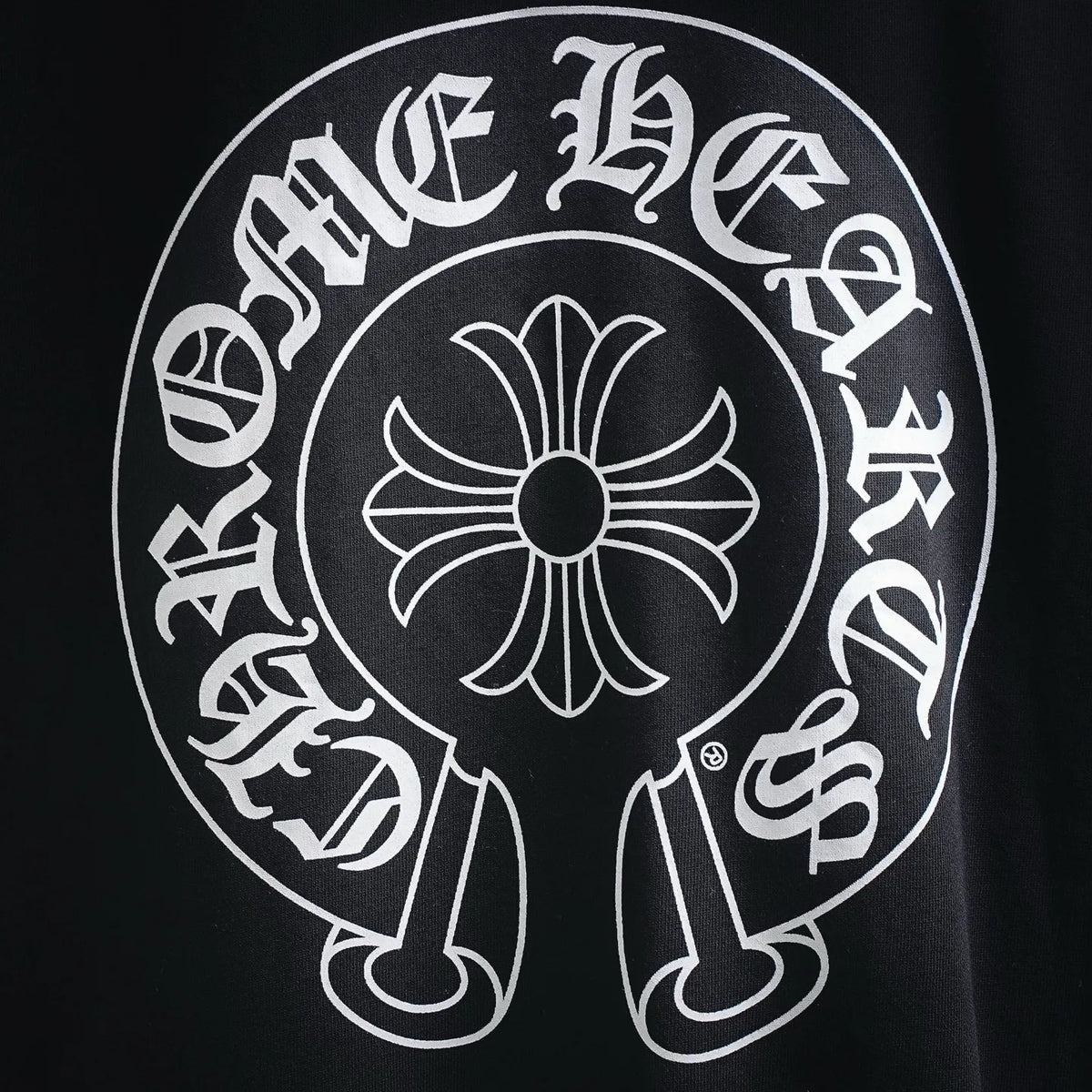 Black sweatshirt with close-up of large circular white logo graphic