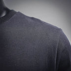 Black sweatshirt fabric and shoulder seam close-up