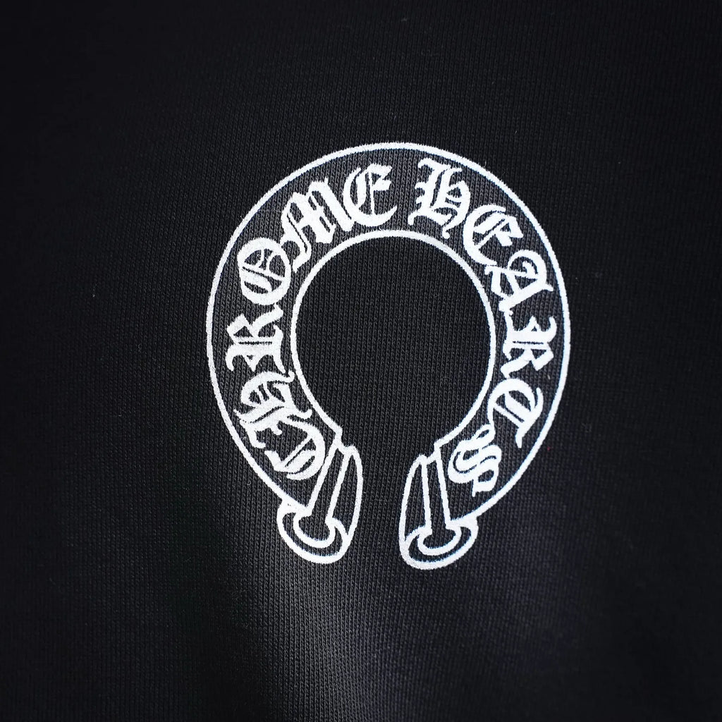 Black sweatshirt sleeve logo with circular white graphic detail