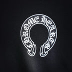 Black sweatshirt sleeve logo with circular white graphic detail