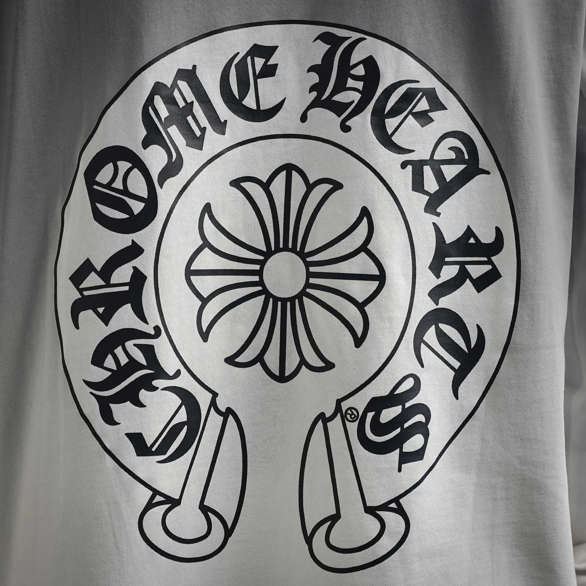 White long-sleeve T-shirt back shows large circular logo graphic
