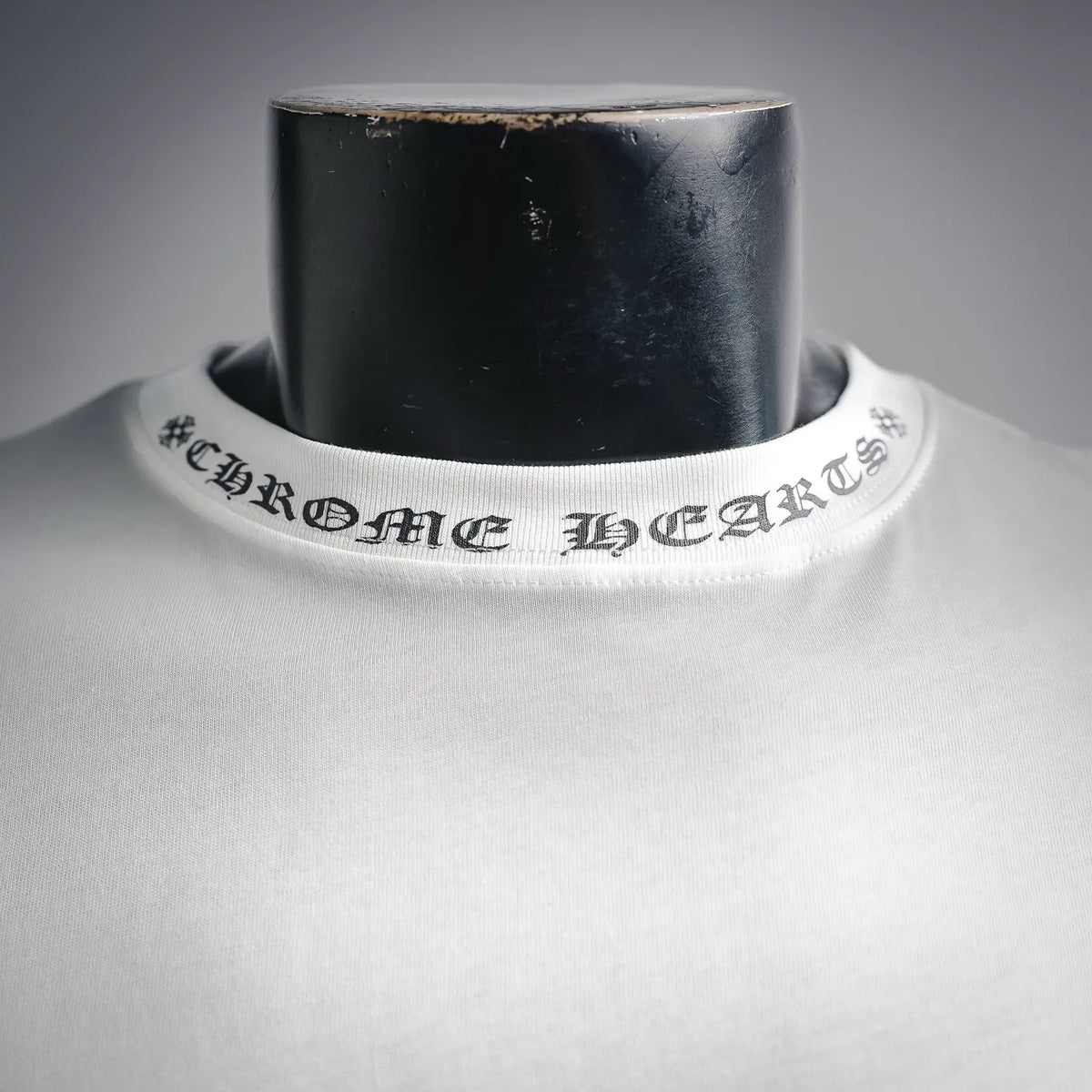 White long-sleeve T-shirt crew neckline with stitched lettering graphic