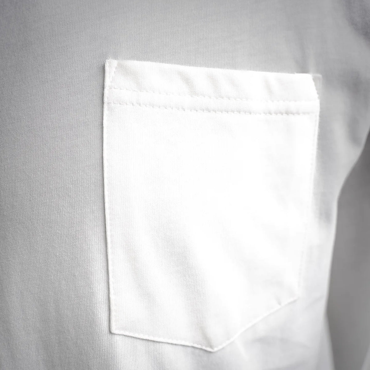 White long-sleeve T-shirt with rectangular chest pocket