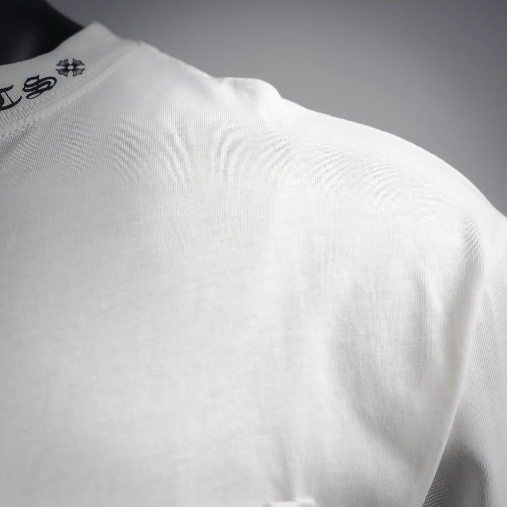 White long-sleeve T-shirt shoulder with visible seam stitching
