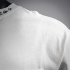 White long-sleeve T-shirt shoulder with visible seam stitching