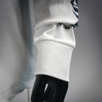 White long-sleeve T-shirt sleeve cuff with graphic print at collar