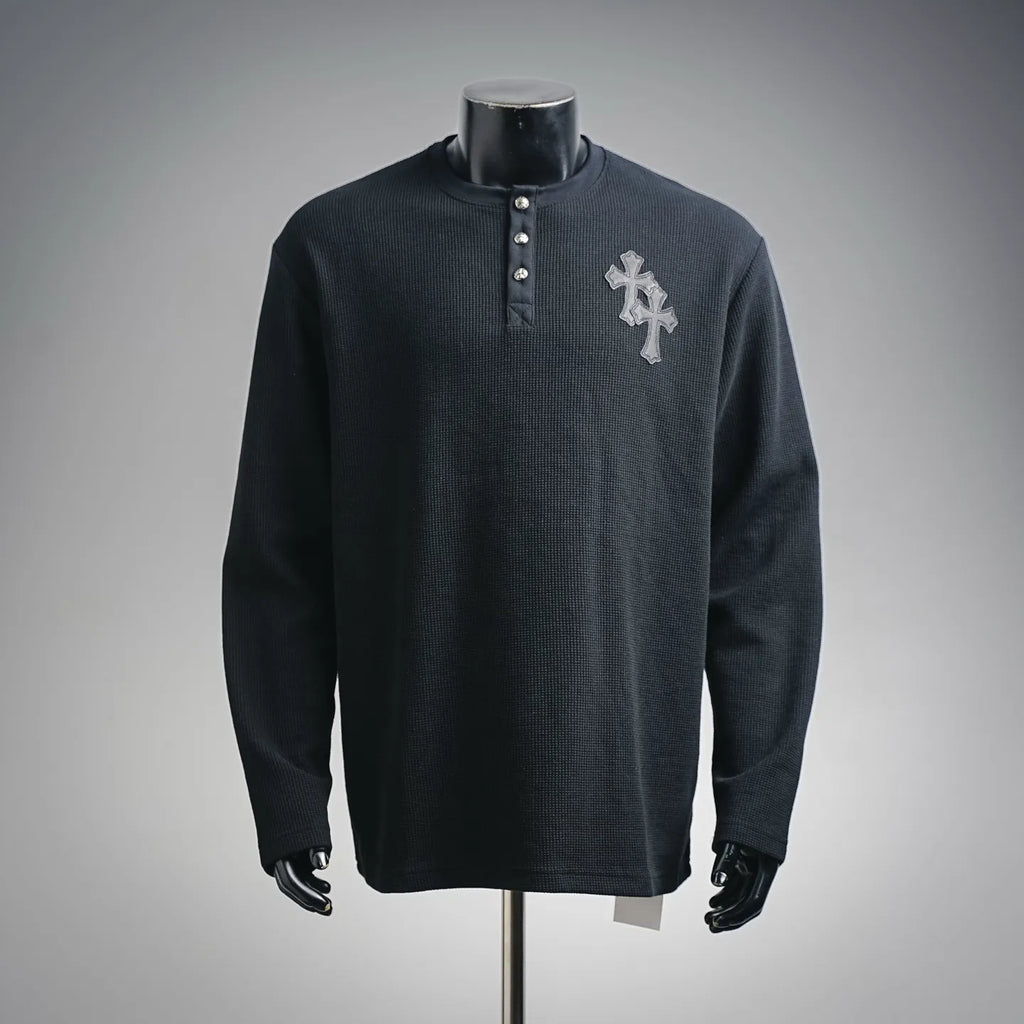 Dark long-sleeve henley shirt with button placket and silver cross patch