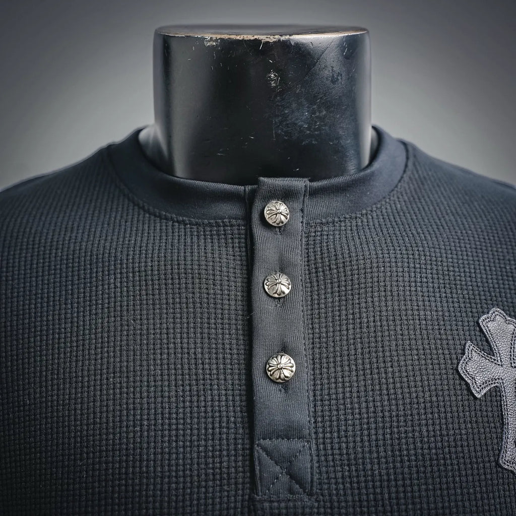 Dark henley collar with snap buttons and ribbed neckline