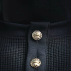 Dark henley placket with decorative round snap buttons