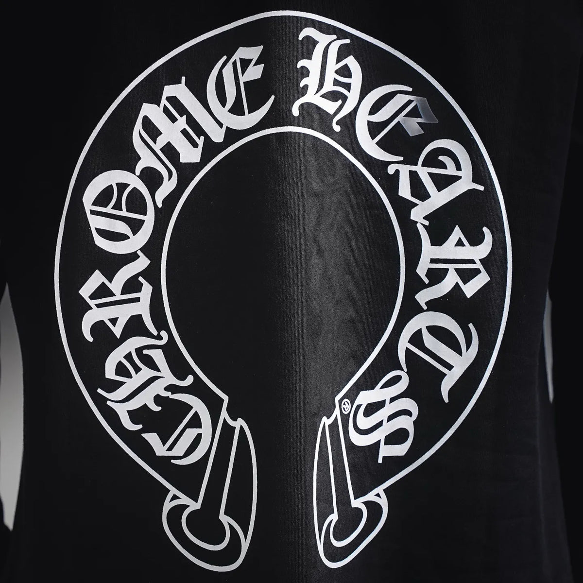 Black long-sleeve T-shirt with large white back face ring graphic