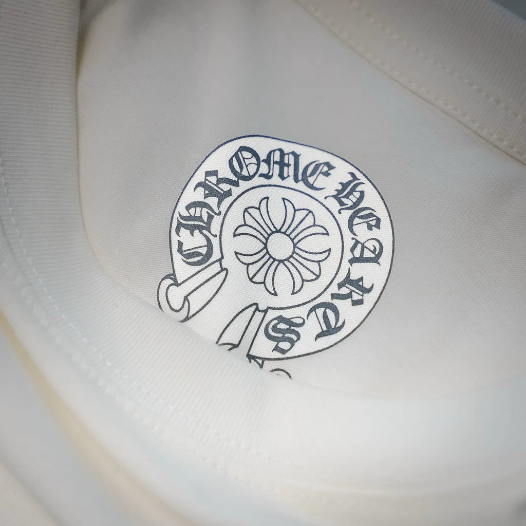 White T-shirt chest printed logo in small circular crest design