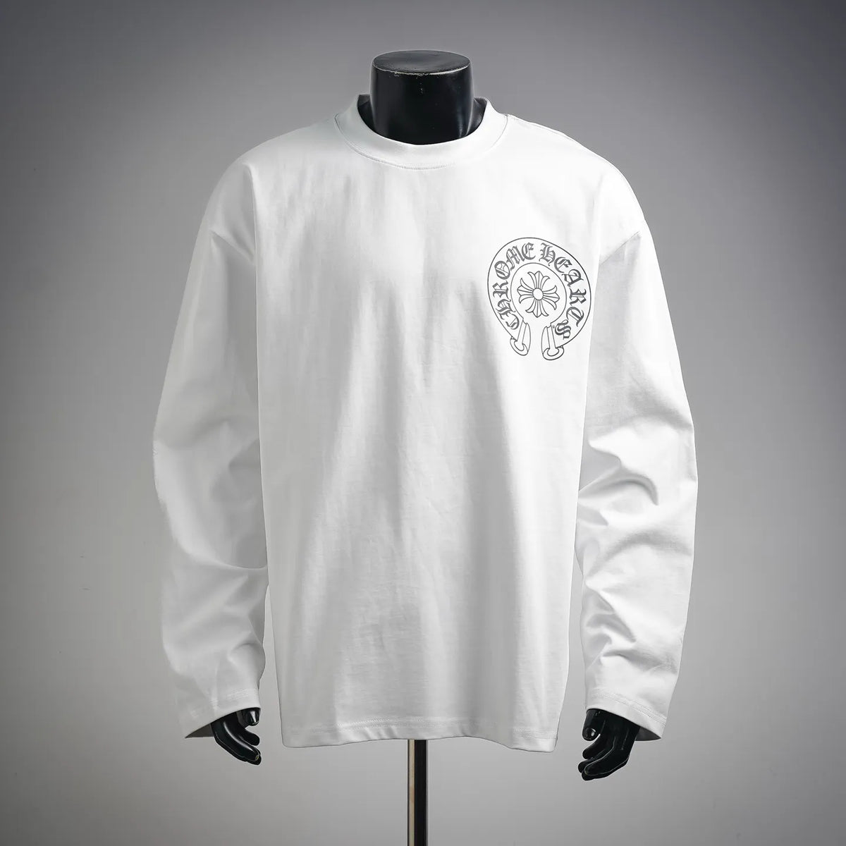 White long-sleeve T-shirt with small circular front logo print