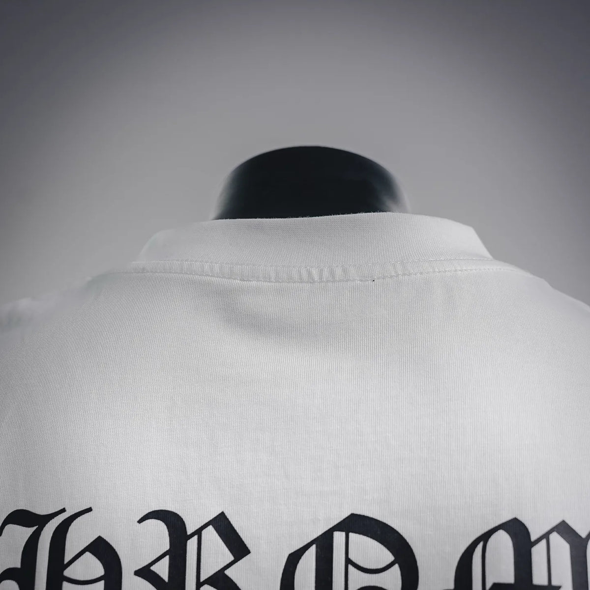 White long-sleeve T-shirt back neckline and shoulder seam detail