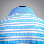 Close-up of blue collar and striped yoke with light-blue patterned band