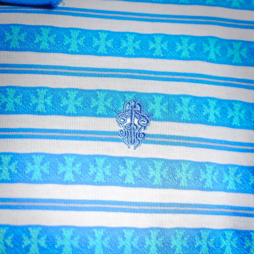 Chest stripe detail with small embroidered emblem on blue and white polo