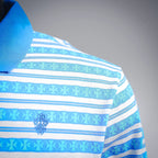 Shoulder and upper chest view of blue and white striped long-sleeve polo