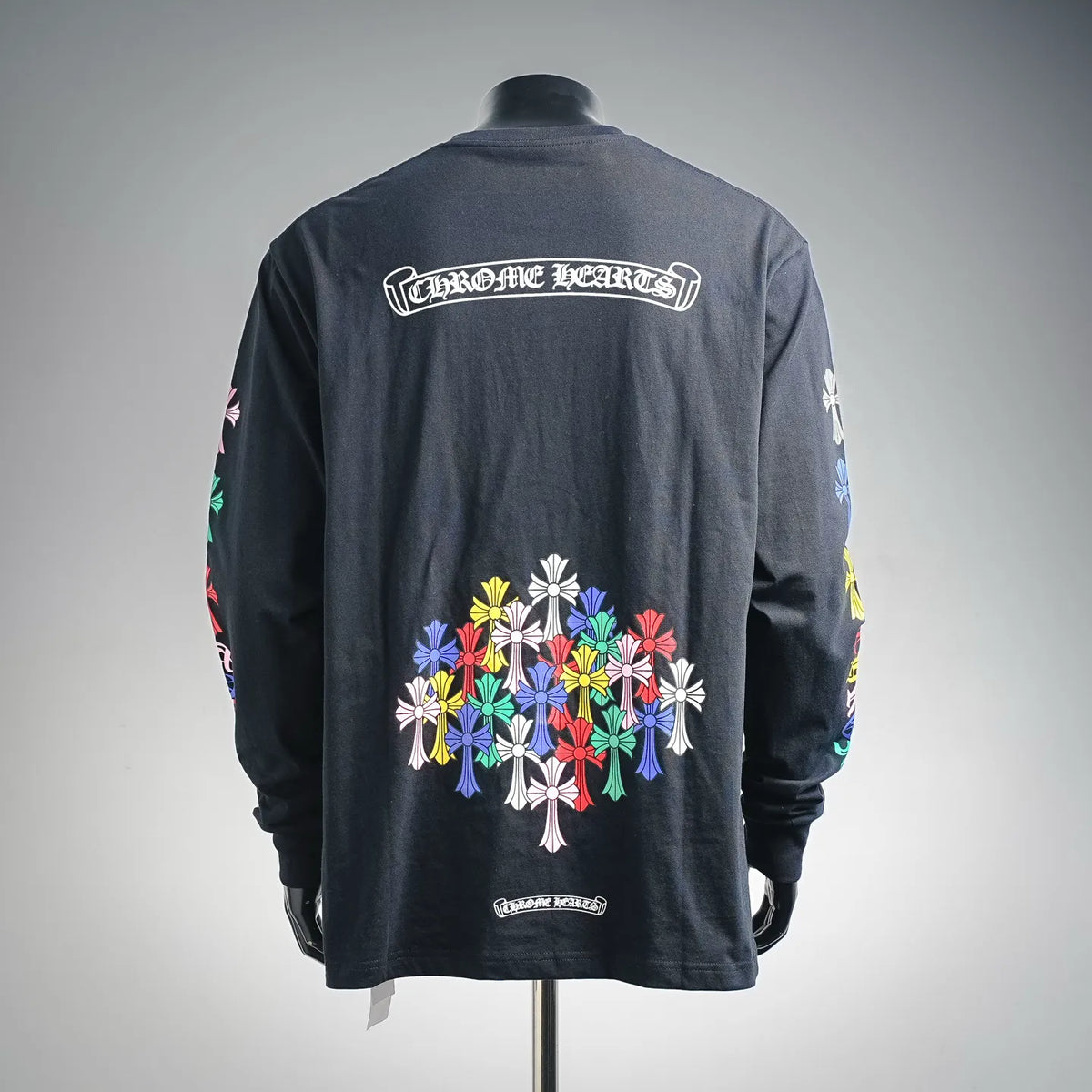 Dark long-sleeve crewneck shirt with large back graphic and Chrome Hearts logo text.