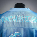 Light blue back of jersey with arched graphic lettering across the upper section