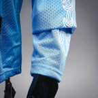 Light blue long-sleeve jersey sleeve and cuff with white graphic pattern detail