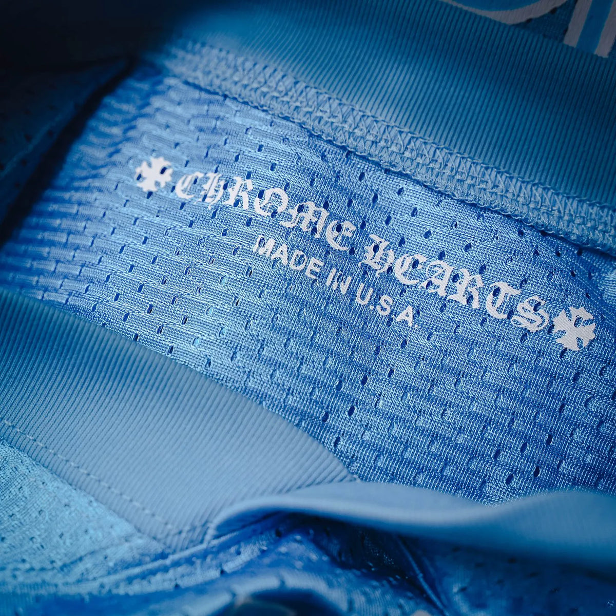 Light blue jersey inside neck label and stitching with Made in U.S.A. text