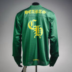 Green long-sleeve jersey with yellow graphic print on the back
