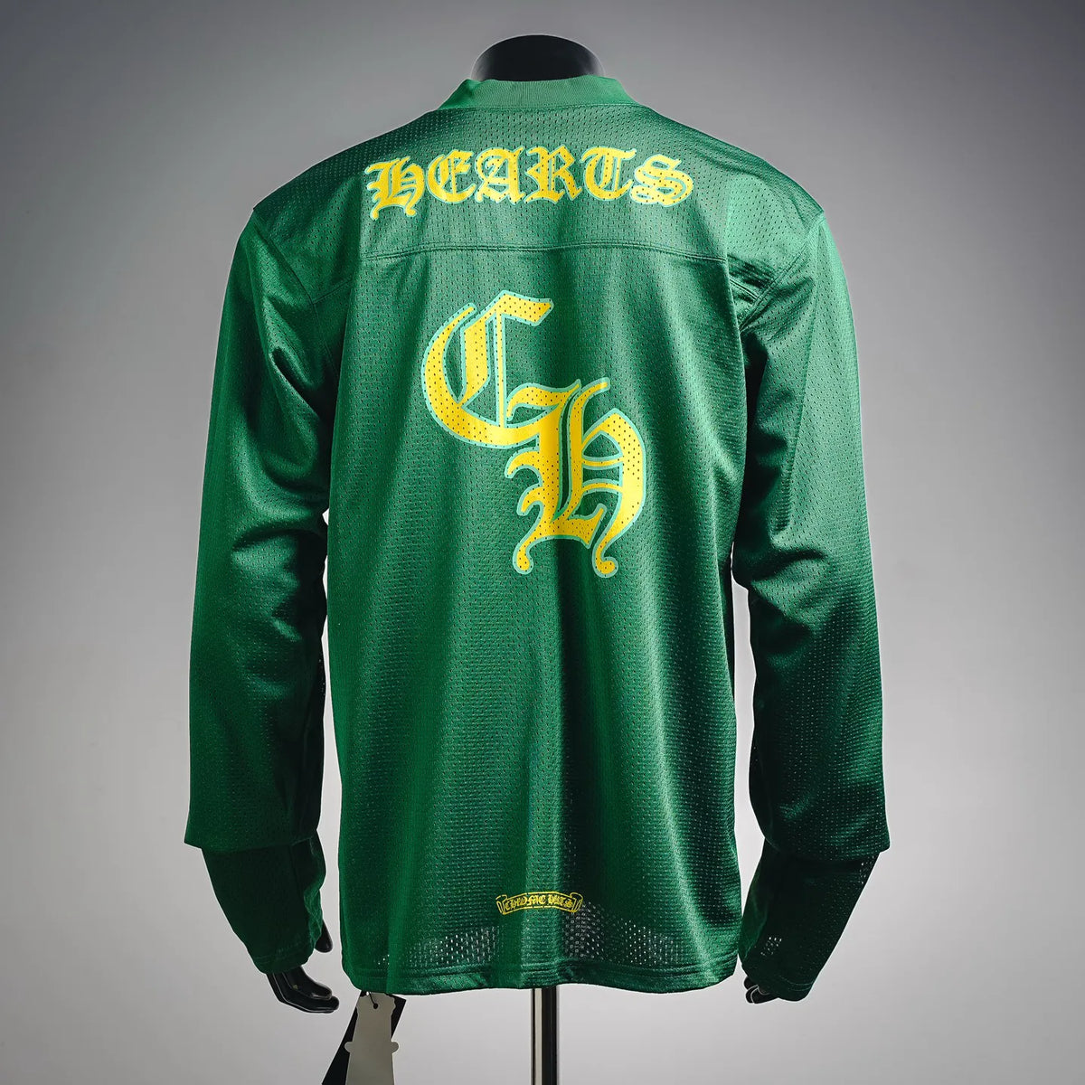 Green long-sleeve jersey with yellow graphic print on the back