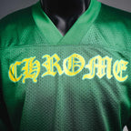 Green jersey front with large yellow stylized name across the chest