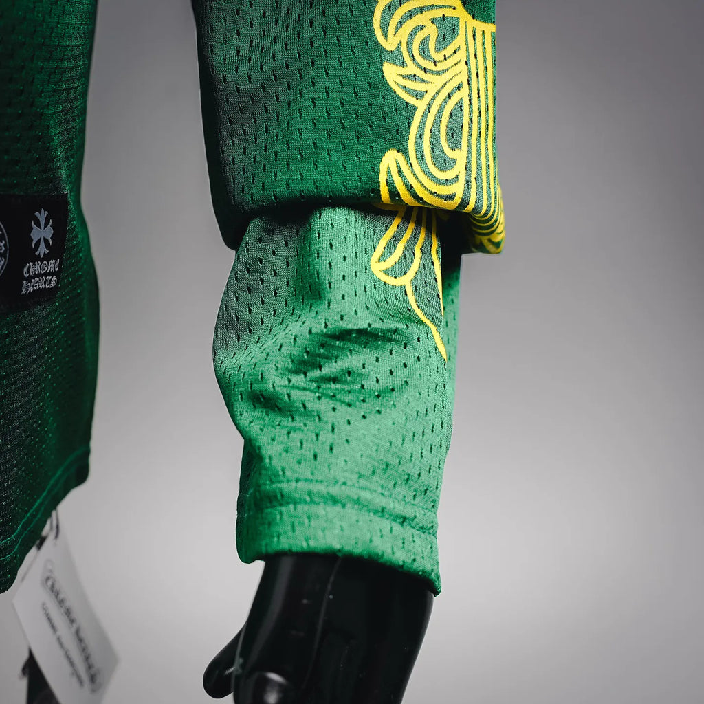 Green long-sleeve jersey with yellow graphic detail at the cuff