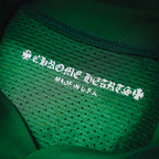 Green jersey with embroidered inside neck label including 'Made in U.S.A.'