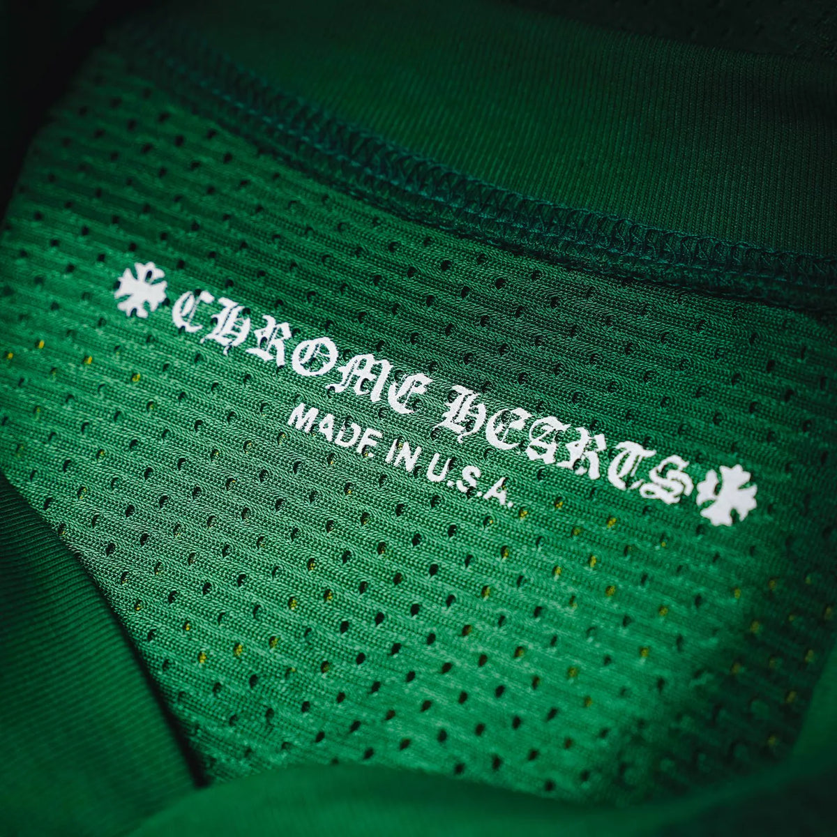 Green jersey with embroidered inside neck label including 'Made in U.S.A.'