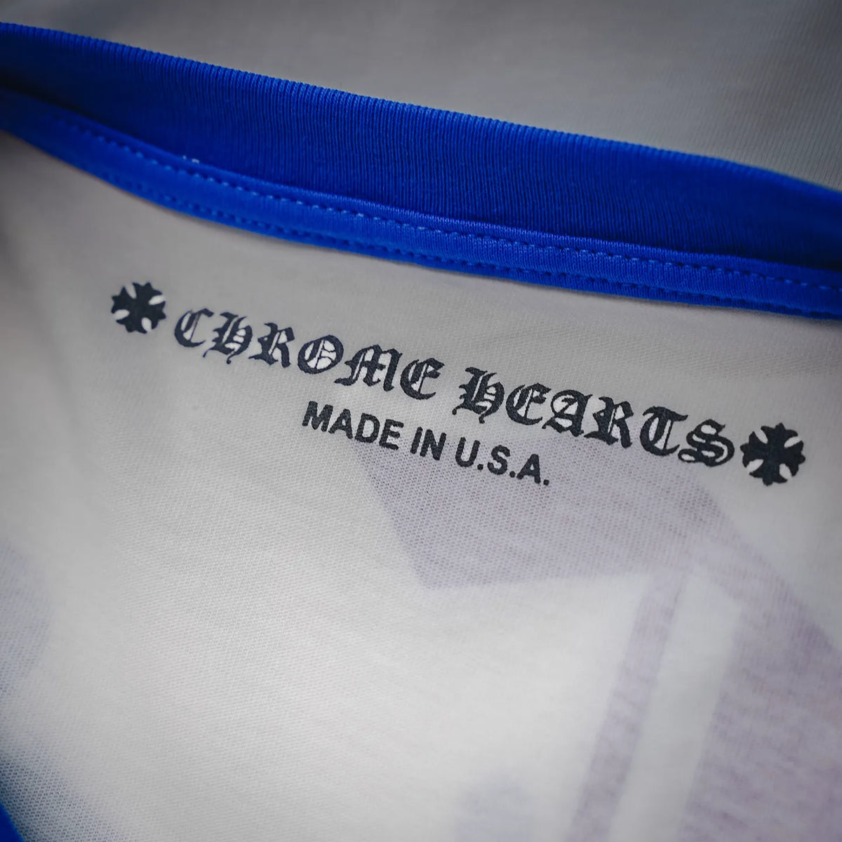 Long-sleeve raglan shirt inner neck label reading “MADE IN U.S.A.”