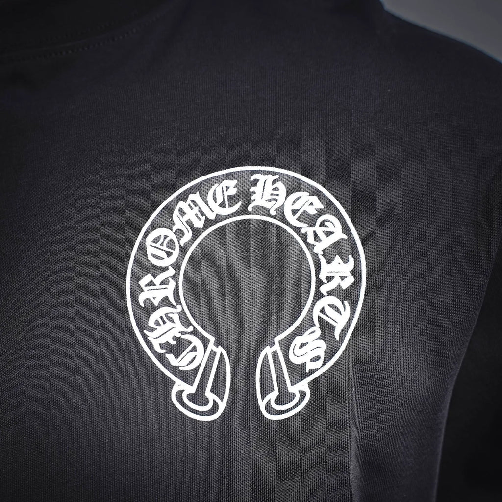 Dark long-sleeve T-shirt front with white circular logo emblem