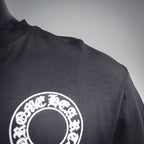 Dark long-sleeve T-shirt shoulder with white circular logo