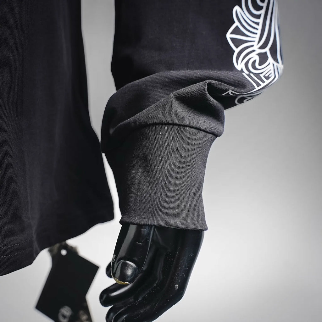 Dark long-sleeve T-shirt sleeve with white decorative cuff graphic
